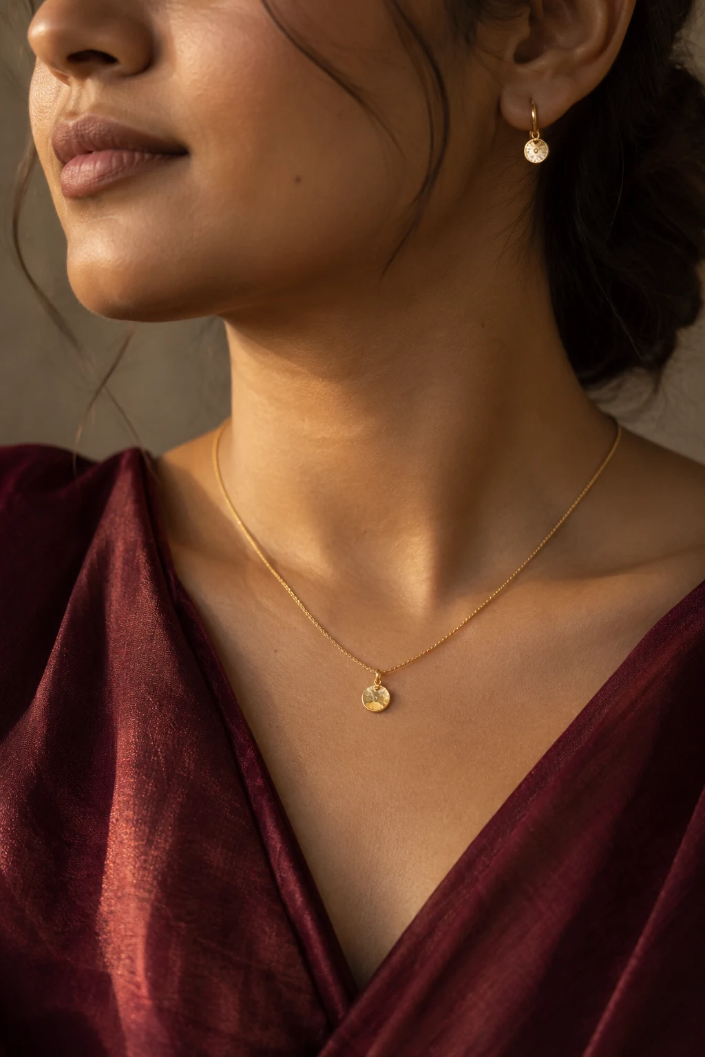Illustrative styling portrait of a woman wearing delicate jewellery